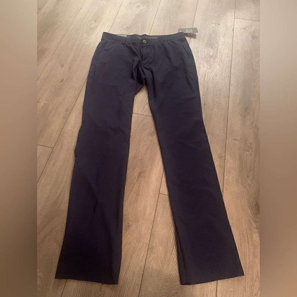 Under Armour mens pants straight, sits at waist with room through hip and thighs